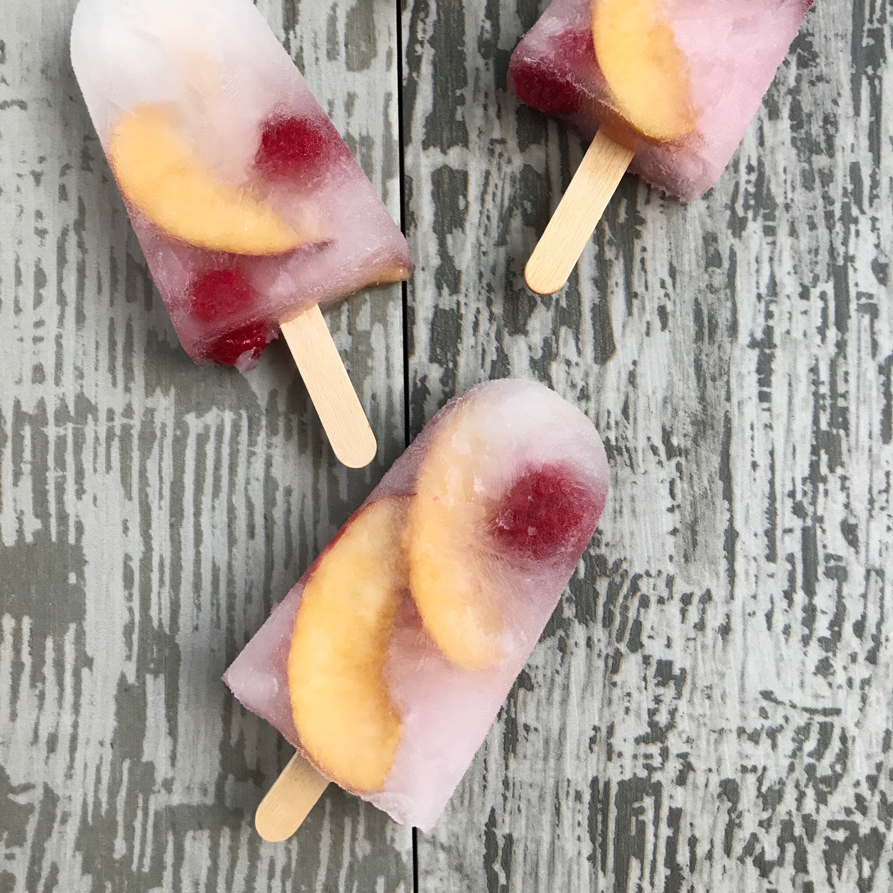 Raspberry Peach Popsicles • One Lovely Life