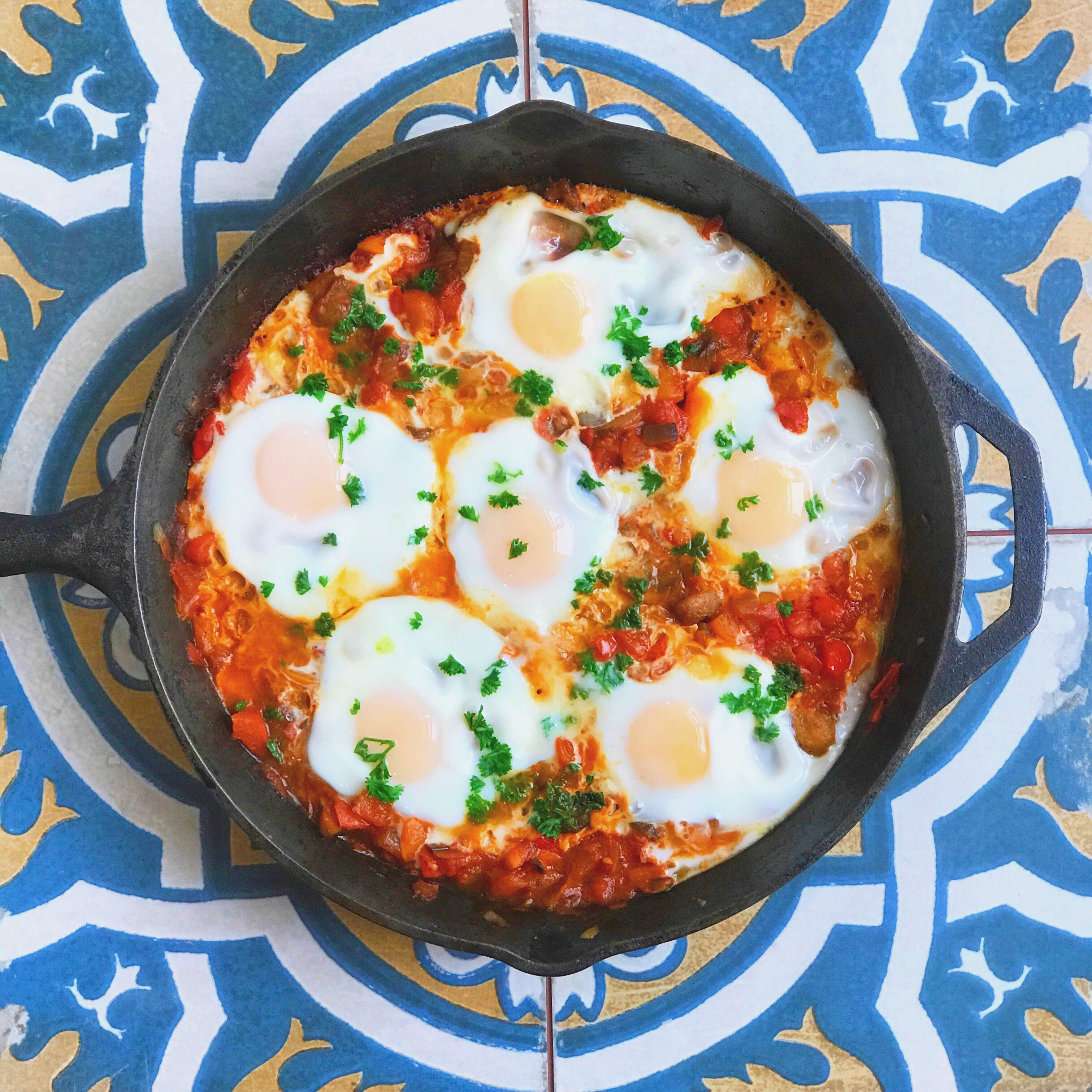 plate of ISRAELI SHAKSHUKA  with fresh eggs