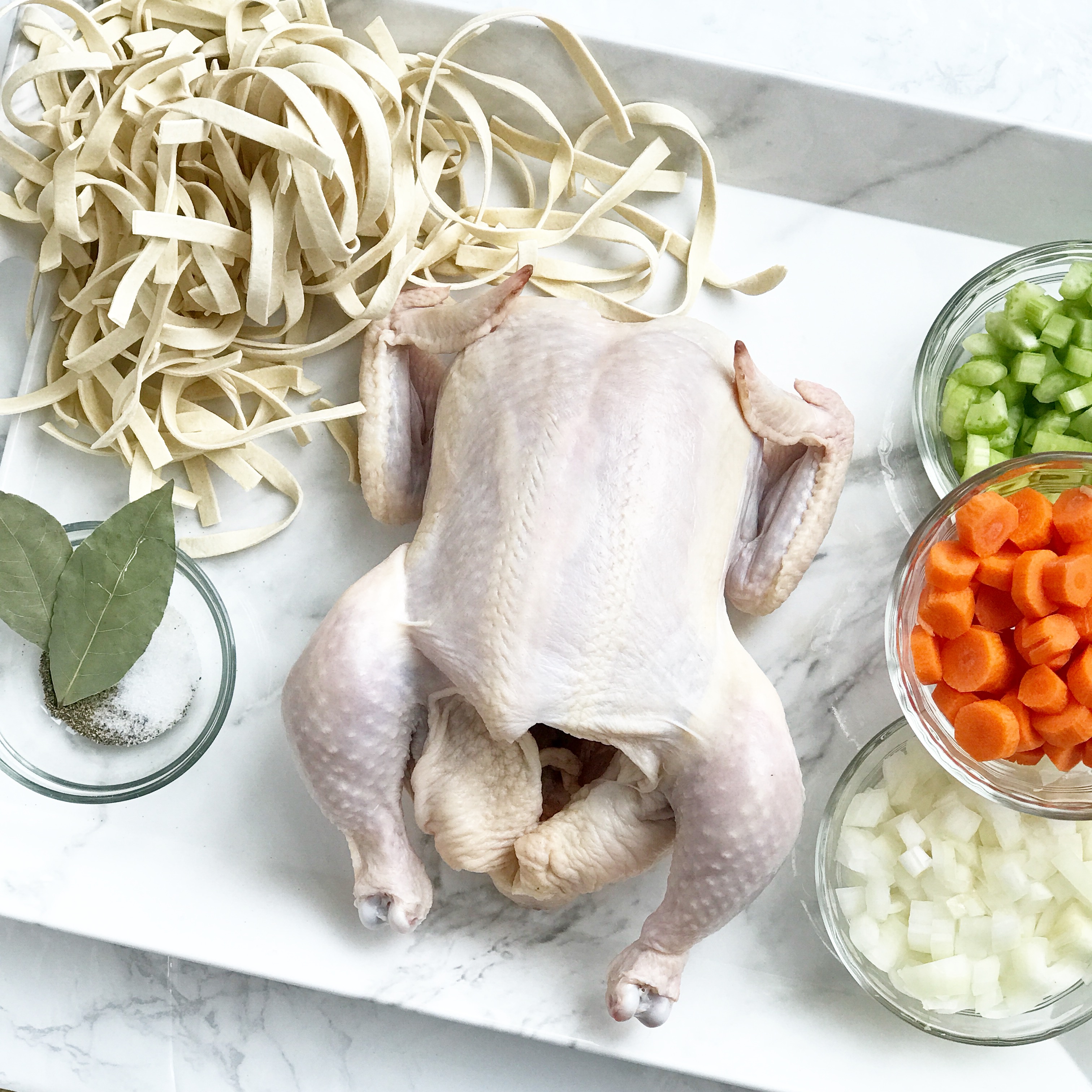 preparing chicken noodle soup with organic ingredients